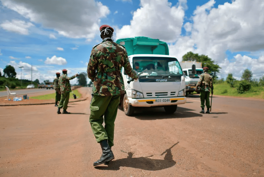 General Service Unit officers, part of Kenya’s police service, stop a commercial vehicle at a checkpoint. Tony Karumba | AFP via Getty Images