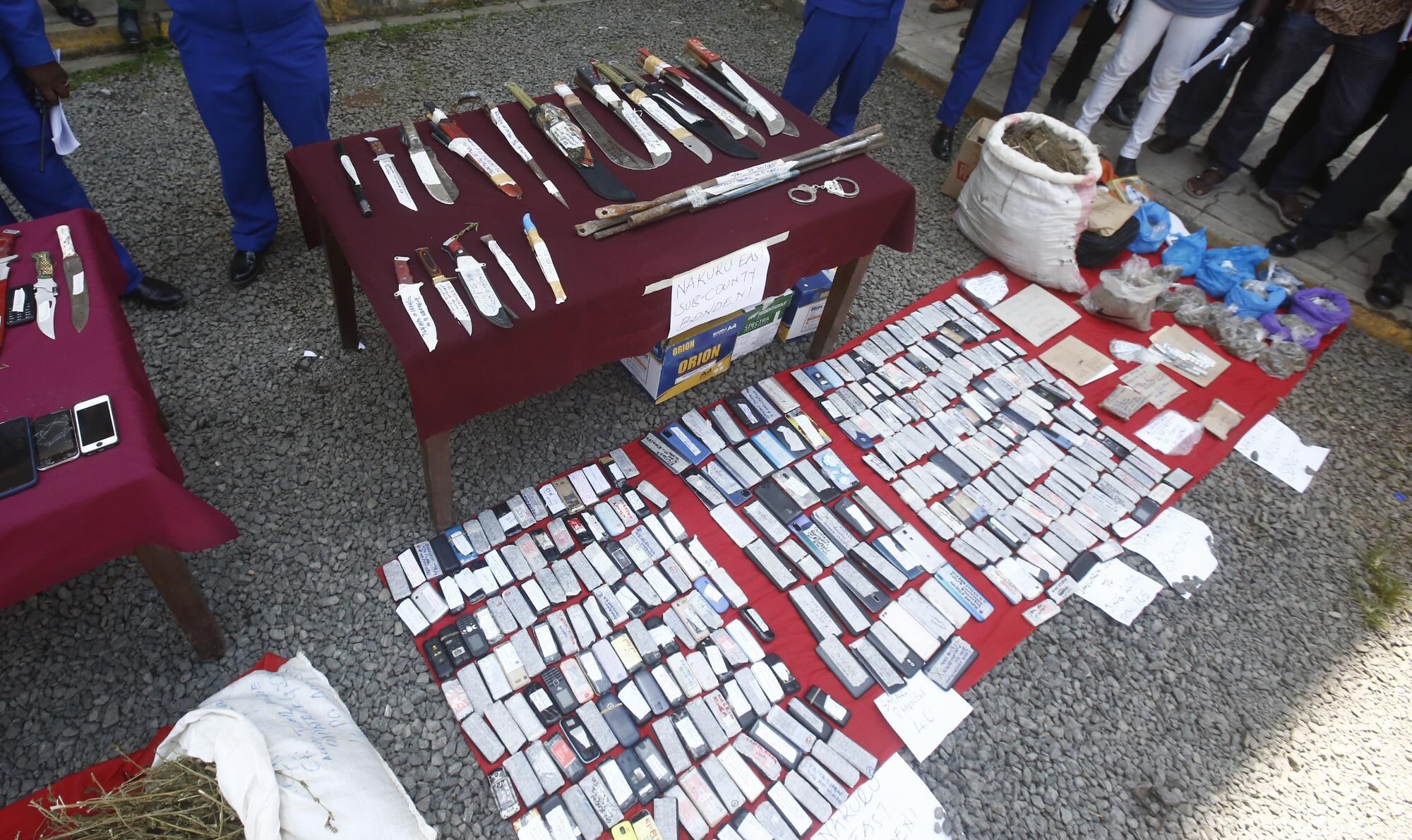 Police In Nakuru Display Items recovered during a crackdown on the confirm criminal gang