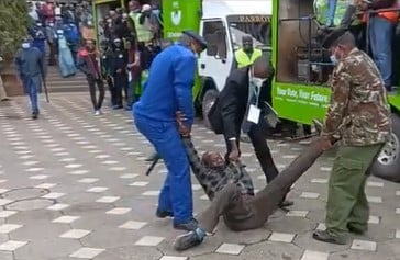 Police whisk away the protestor from IEBC's Tuesday, July meeting at KICC, Nairobi.PHOTO/COURTESY