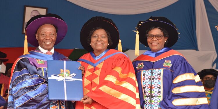 Kristina Wambui Pratt(center) receiving her Honorary Degree from Kenyatta University.Photo/Twitter