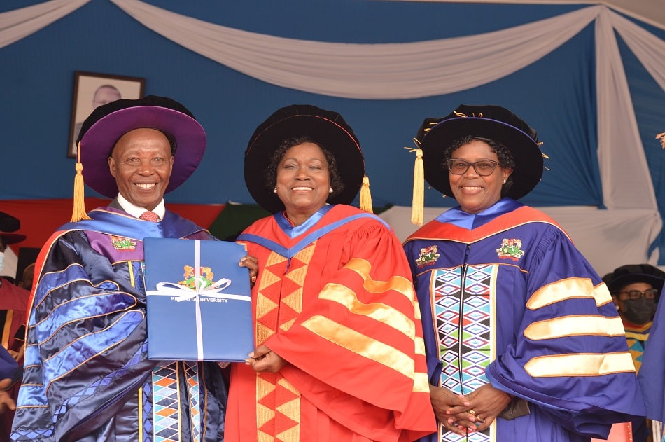 Kristina Wambui Pratt(center) receiving her Honorary Degree from Kenyatta University.Photo/Twitter