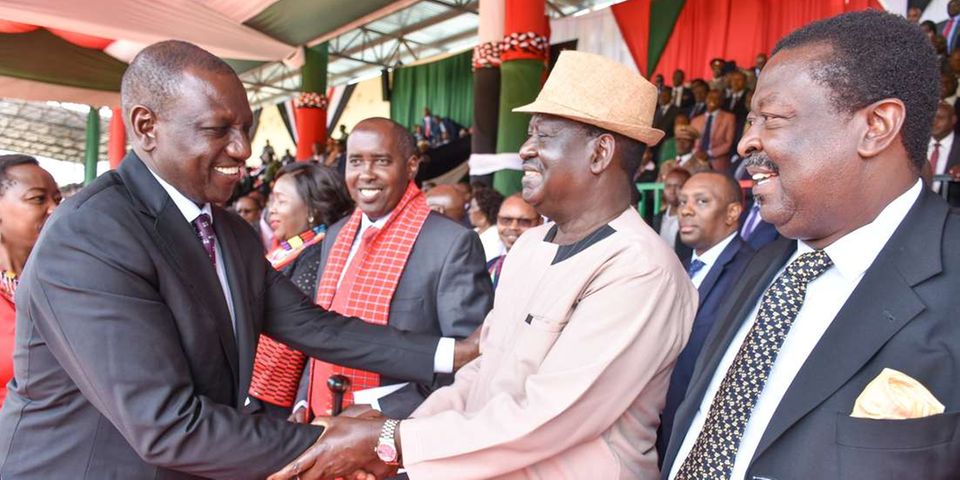 Deputy President William Ruto chats with Former Prime Minister Raila Odinga and ANC Leader Musalia Mudavadi during the 56th Madaraka Day Celebrations at Narok Stadium, Narok County.PHOTO/DPPS