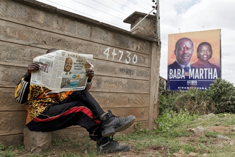 The race is currently too close to call between presidential frontrunners William Ruto and Raila Odinga (left on the billboard) | AFP