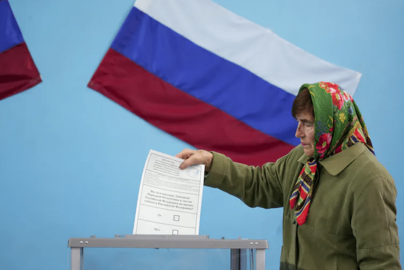 A woman votes in the controversial referendum in Donetsk, Ukraine on Sept. 27, 2022 |  Stringer/Anadolu Agency via Getty Images
