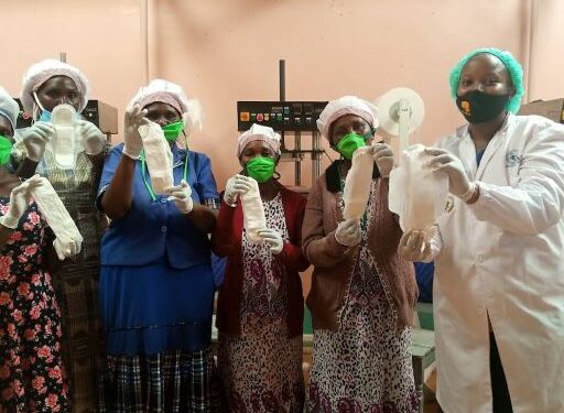Mary Nyaruai(in white dust coat) with a group of women leading the production of sanitary pads from agricultural waste