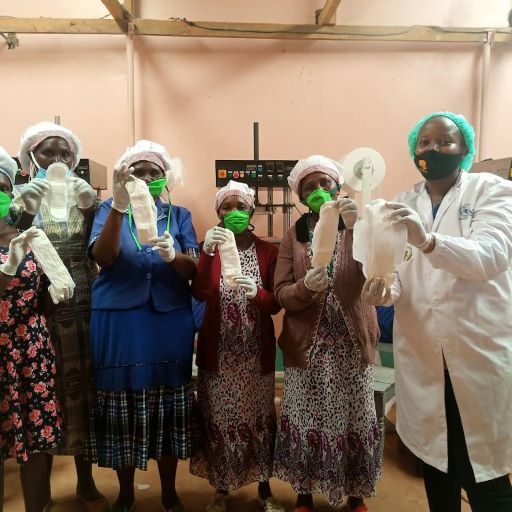 Mary Nyaruai(in white dust coat) with a group of women leading the production of sanitary pads from agricultural waste