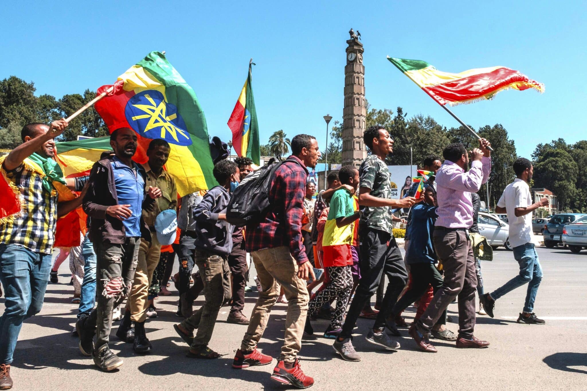 People carry Amhara flags and Ethiopian national flags to stand in honor of the Ethiopian army in the Tigray conflict, Addis Ababa, Ethiopia, Nov. 17, 2020. (AFP Photo)