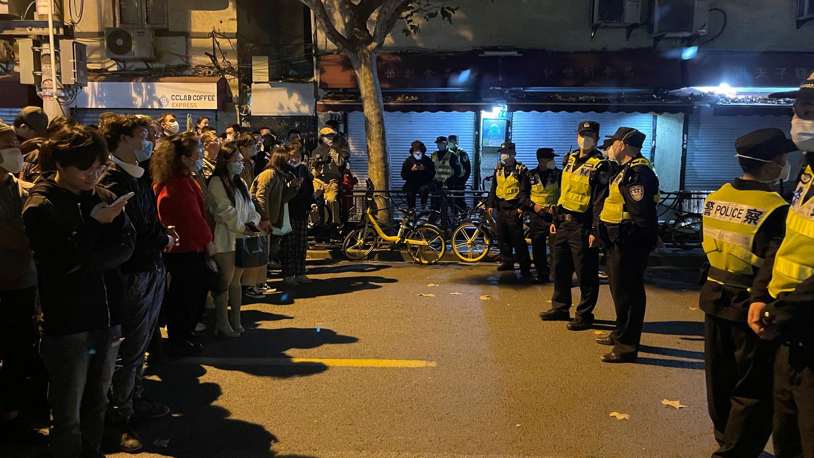 People confront a line of police officers in Shanghai, China.
Photo: Sky News