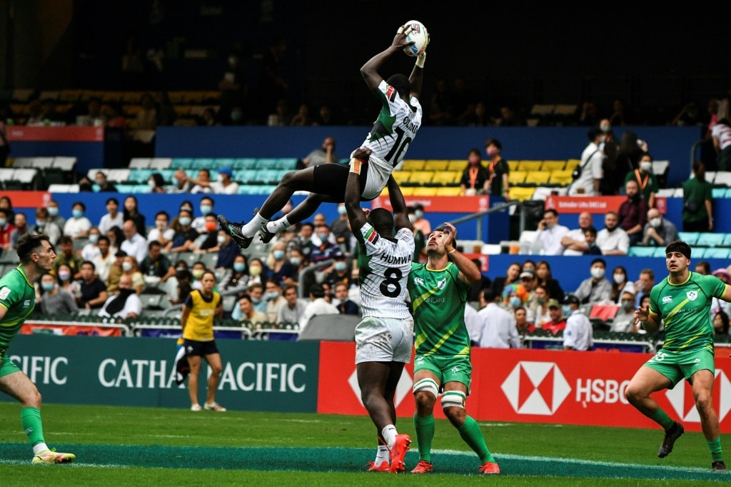 AFP Kenya's Johnstone Olindi (top) is lifted by teammate Herman Humwa (C) against Ireland in the Hong Kong Sevens rugby tournament on November 4, 2022. Kenya's Rugby Sevens