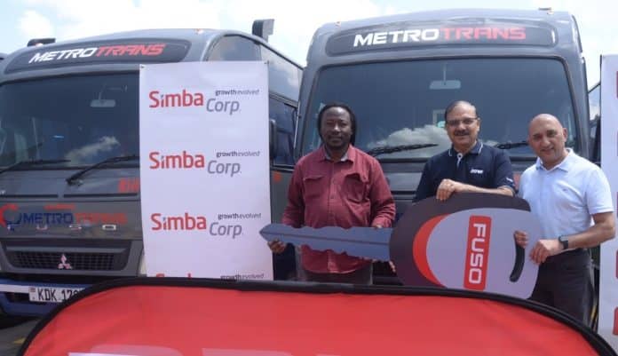 MetroTrans CEO Oscar Rosanna, Simba Corp Motors MD Naresh Leekha and Mehul Sachdev, Product Manager, Pick Ups and Buses, during the handover of the fleet of 20 new Fuso buses to Metro Trans Ltd. [ PHOTO / Courtesy ]