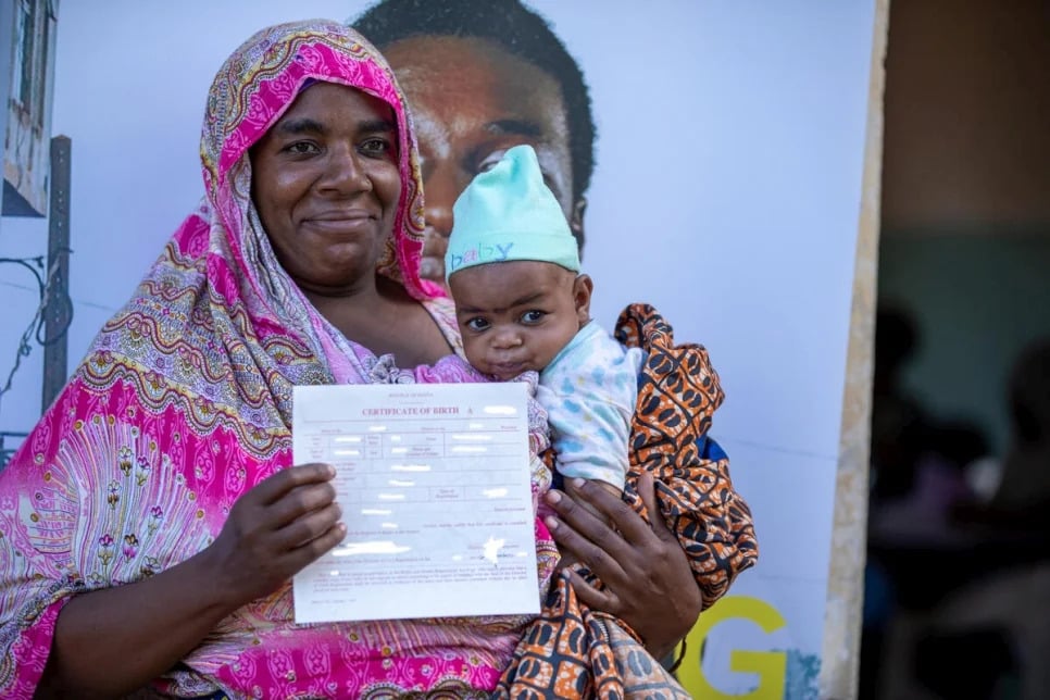 Laila Rashidi, a 48-year-old mother of 10 from the Pemba community in Kenya collects a birth certificate for her son. PHOTO/UNHCR