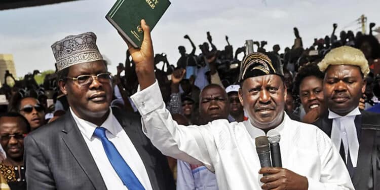 Lawyer Miguna Miguna and Raila Odinga during Raila's swearing-in ceremony as the president of the People's Assembly in Nairobi, Kenya January 30, 2018.PHOTO/COURTESY