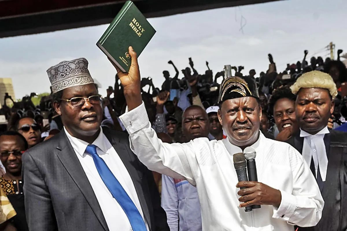 Lawyer Miguna Miguna and Raila Odinga during Raila's swearing-in ceremony as the president of the People's Assembly in Nairobi, Kenya January 30, 2018.PHOTO/COURTESY