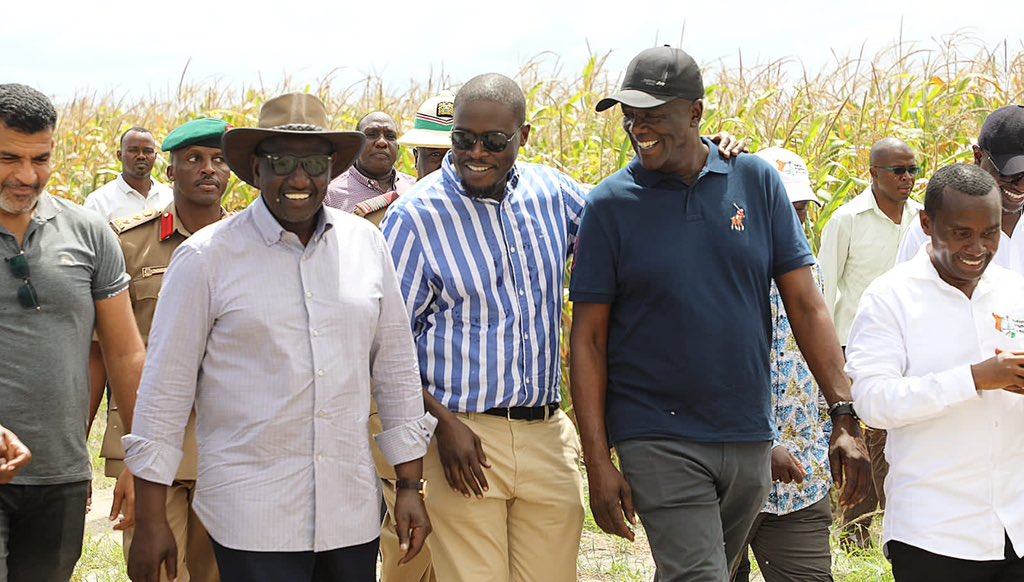 Nairobi Governor Johnson Sakaja (in stripped shirt)  with President William Ruto during a tour of the Galana Kulalu project.Photo/Courtesy
