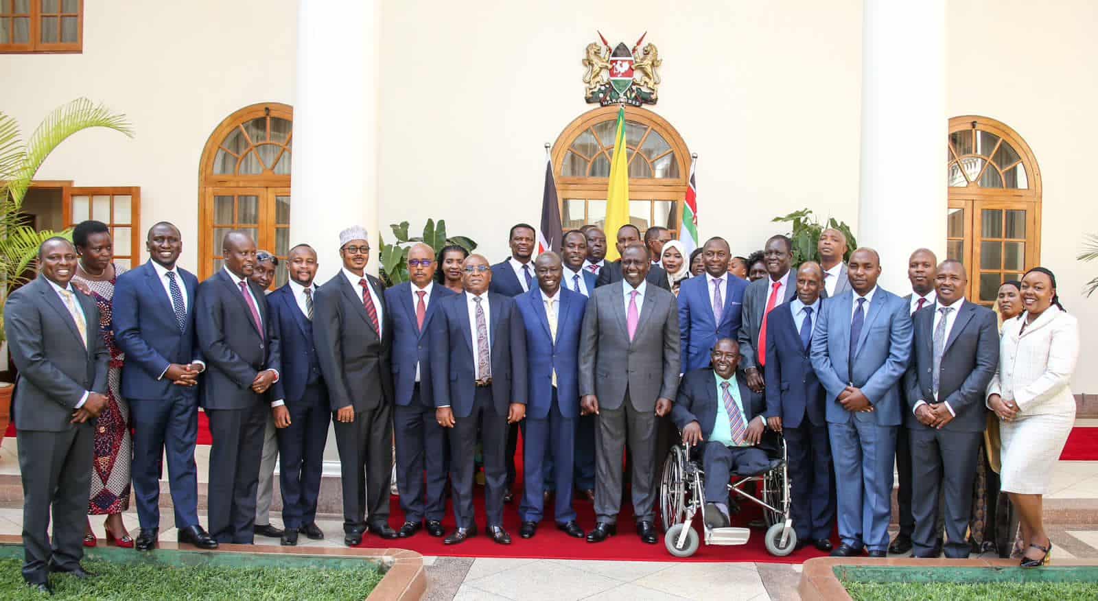 President William Ruto poses for a photo at State House Nairobi on Wednesday, February 8 with 30 Jubilee party MPs.PHOTO/State House Nairobi.