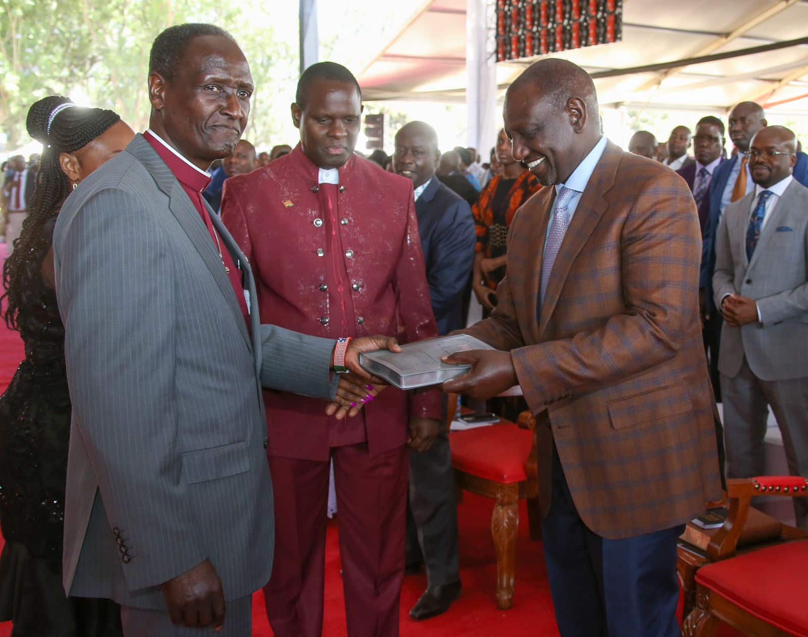 President William Ruto is gifted a bible by the clergy during a prayer service in Nakuru.Photo/PCS