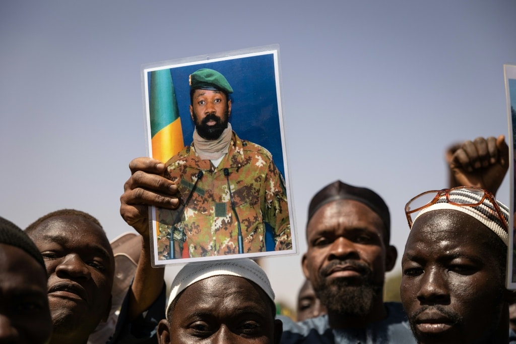 Support: Demonstrators at a rally in the Burkinabe capital Ouagadougou in January 2022 hold up a picture of Malian junta leader Colonel Aissimi Goita | AFP