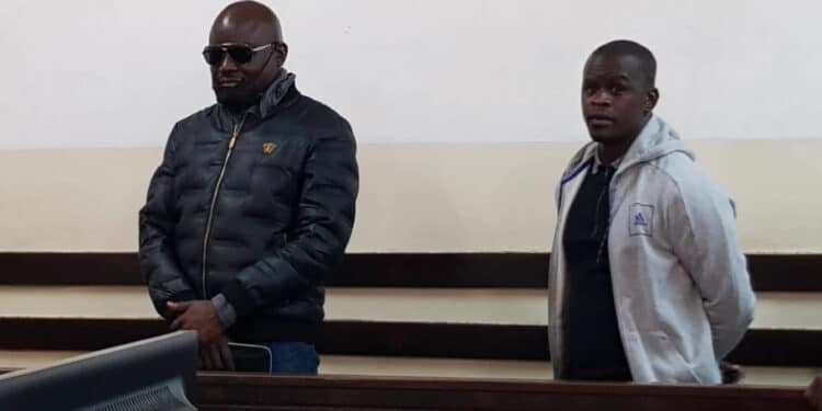 Thomas Otieno Ngoe (Left) and Nicholas Otieno Ndolo arraigned in a Nairobi court on March 15, 2023. PHOTO| COURTESY