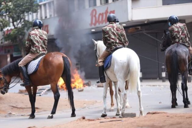 Anti-riot police officers patrol during anti-government demos on Monday.Photo/Courtesy