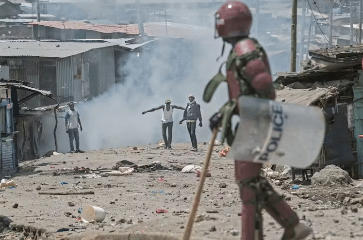 Protesters face off with an anti-riot police officer in Nairobi, Kenya, in March 2023 |  Tony Karumba/AFP via Getty Images