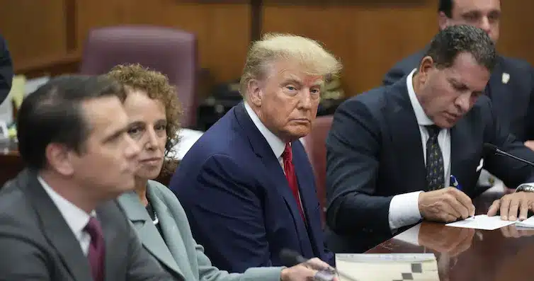 Former president Donald Trump sits at the defence table with his legal team in a Manhattan court. He’s facing charges related to falsifying business records in a hush money investigation, the first U.S. president ever to be charged with a crime.
(AP Photo/Seth Wenig)z