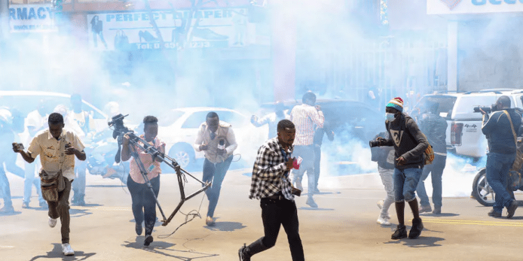 Journalists take cover during March 2023 protests in Kenya | Boniface Muthoni/SOPA Images