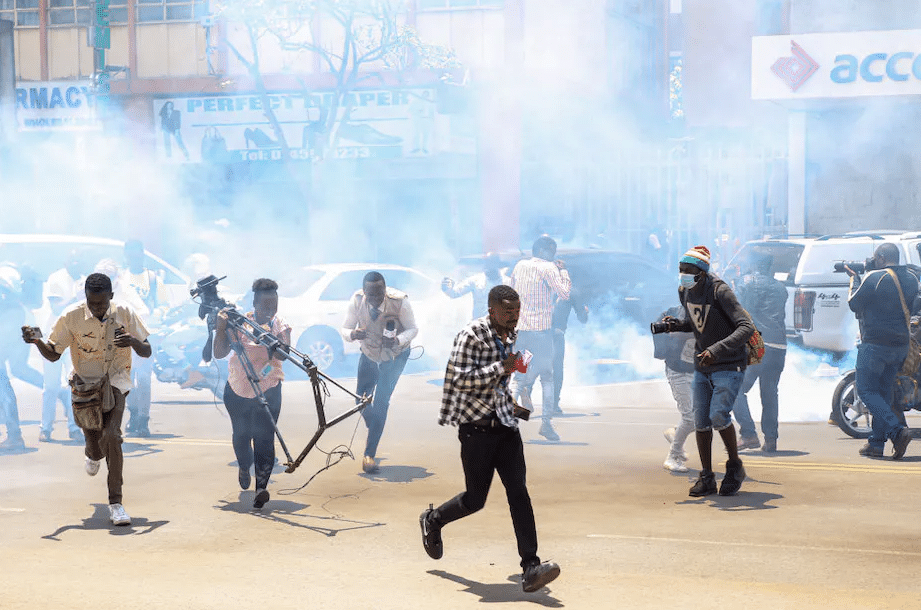 Journalists take cover during March 2023 protests in Kenya | Boniface Muthoni/SOPA Images