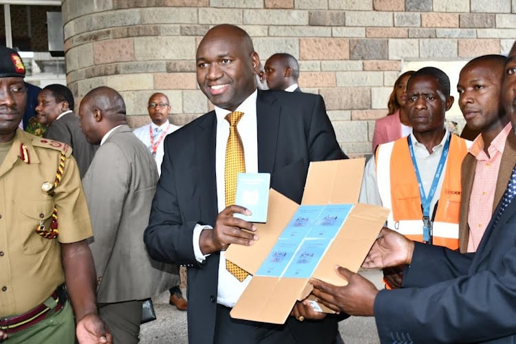 PS Bitok when he received passport booklets at Nyayo House, Nairobi. Photo/Courtesy