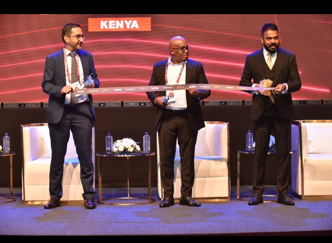 KIB Acting CEO James Wanjagi (Center) Sudhir Ranjan Jena (Left), and Isfandyar Zaman Khan (Right) cutting the ribbon to officially kick off World Financial Innovation Series (WFIS) 2023 – Kenya.