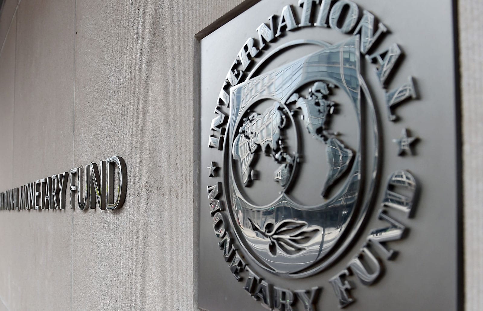 An exterior view of the building of the International Monetary Fund (IMF), with the IMG logo, is seen on March 27, 2020 in Washington, DC. - The coronavirus pandemic has driven the global economy into a downturn that will require massive funding to help developing nations, IMF chief Kristalina Georgieva said on March 27, 2020. (Photo by Olivier DOULIERY / AFP) (Photo by OLIVIER DOULIERY/AFP via Getty Images)