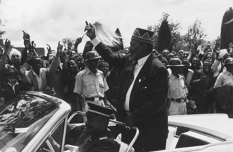 Kenya’s first president Jomo Kenyatta waves at a crowd | Harry Benson/Getty Images