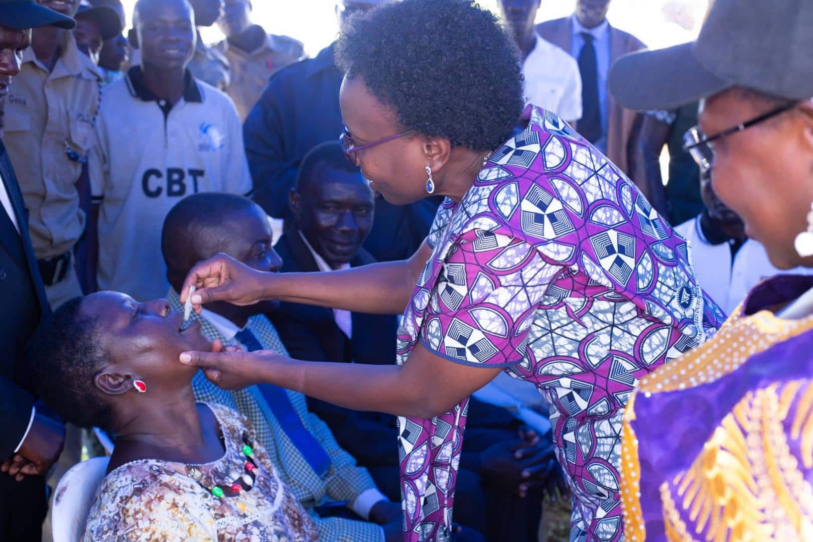 Minister of Health Dr Jane Ruth Aceng vaccinates a member of the community at the OCV launch (1). PHOTO/Courtesy