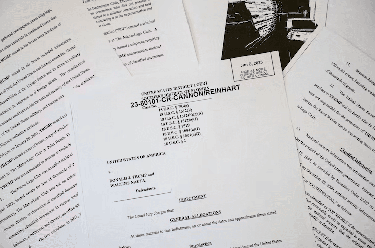 The indictment of Donald Trump and an aide was ‘laced with rhetorical and narrative techniques.’ Photo Illustration by Drew Angerer/Getty Images