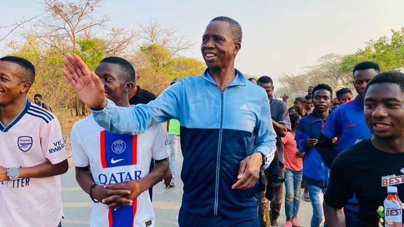EX Zambian president greeting citizens during his jogging sessions.