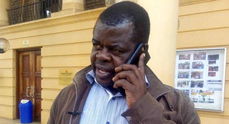 An undated photo of Busia Senator Okiyah Omtatah speaks on phone at the Milimani Law Courts in Nairobi.