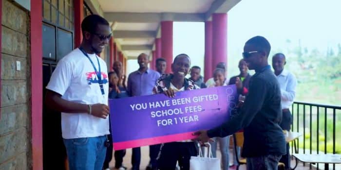 Leonard Maingi receiving a one year scholarship