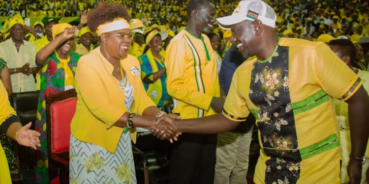 Water and Sanitation Cabinet Secretary Alice Wahome (left) shakes hands with President William Ruto during a UDA faction in 2022.