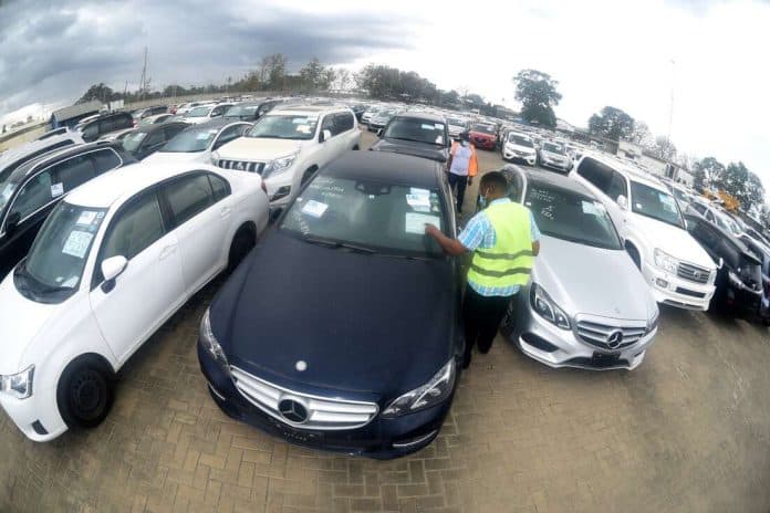 KRA officers inspect cars at the Port of Mombasa.