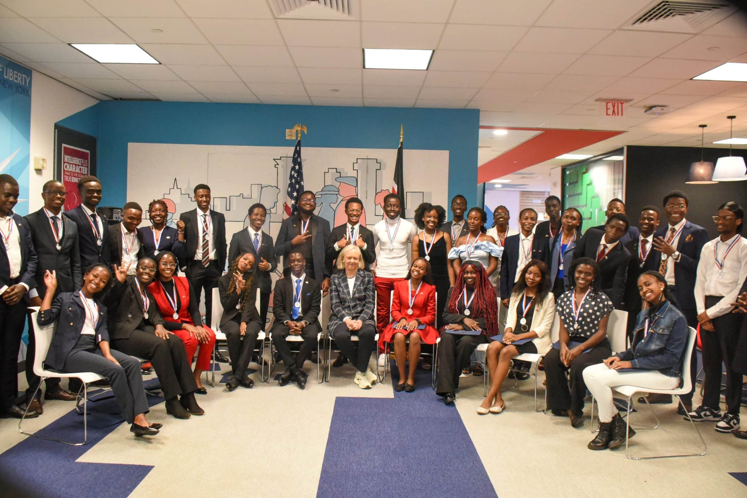 US Ambassador to Kenya Meg Whitman (center) poses for a photo with Kenyan scholars under the US Education program in 2023.