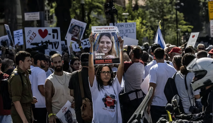 Israelis whose relatives are being held hostage demonstrate on October 26, 2023 in front of the Defense Ministry building in Tel Aviv, demanding the government to bring back their loved ones.