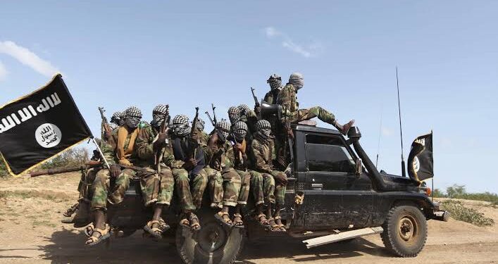 Members of the Al-Shabab group ride in a pick-up outside Mogadishu, Somalia in 2011. PHOTO/Reuters.