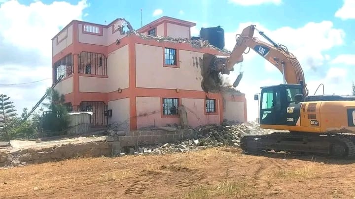 An excavator demolishes a house in Mavoko, Machakos County.