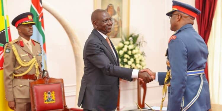 President William Ruto shakes hands with Chief of Defence Forces General Francis Ogolla.