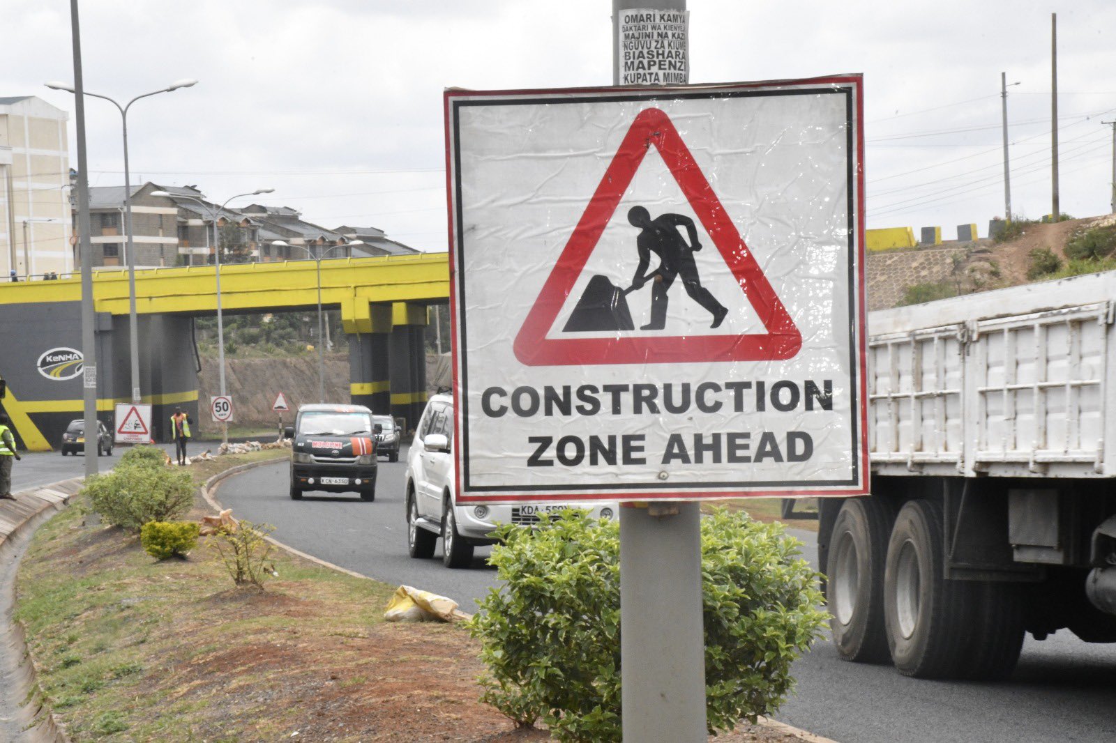 Photo of road signs erected along the southern bypass on ongoing construction works along the road. PHOTO/KeNHA.