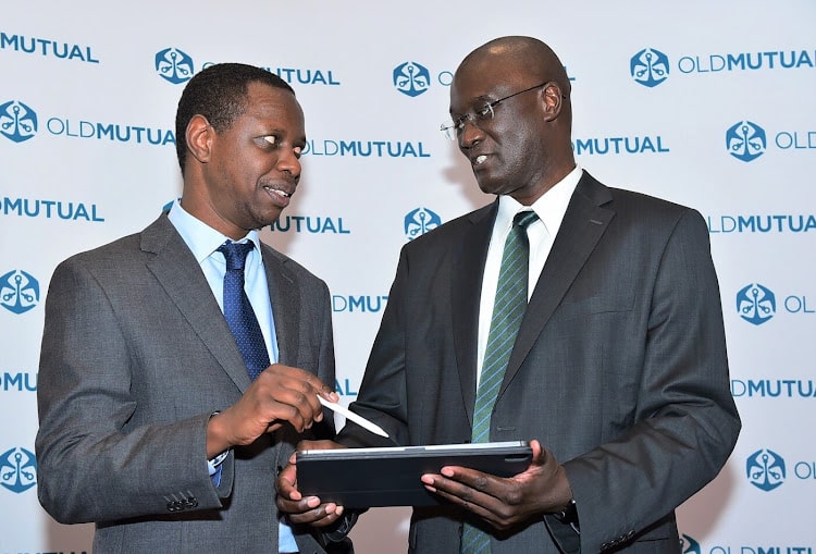 David Muchai, Old Mutual Group chief financial officer alongside the firm's CEO Arthur Oginga during the announcement of Old Mutual Holdings PLC’s half-year results in Nairobi on September 27, 2024. PHOTO/Old Mutual.