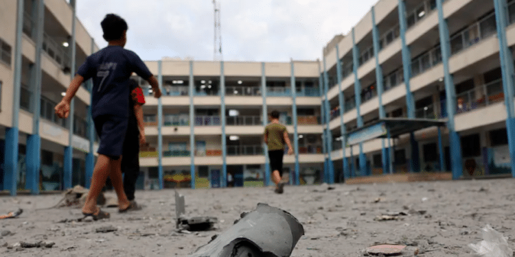 Palestinian Children Walk Through The Rubble Of A School Run By The United Nations Shortly After An Israeli Offensive On The Night Of 8 To 9 October 2023.