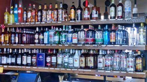 Alcohol. Bottles of alcohol on a shelf.Bottles of alcohol on a shelf.