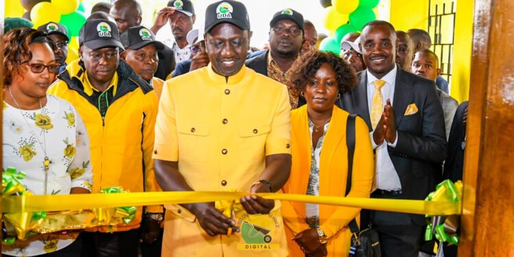 President William Ruto (center) cuts a ribbon during the UDA NDC conference in Bomas in September, 2023.