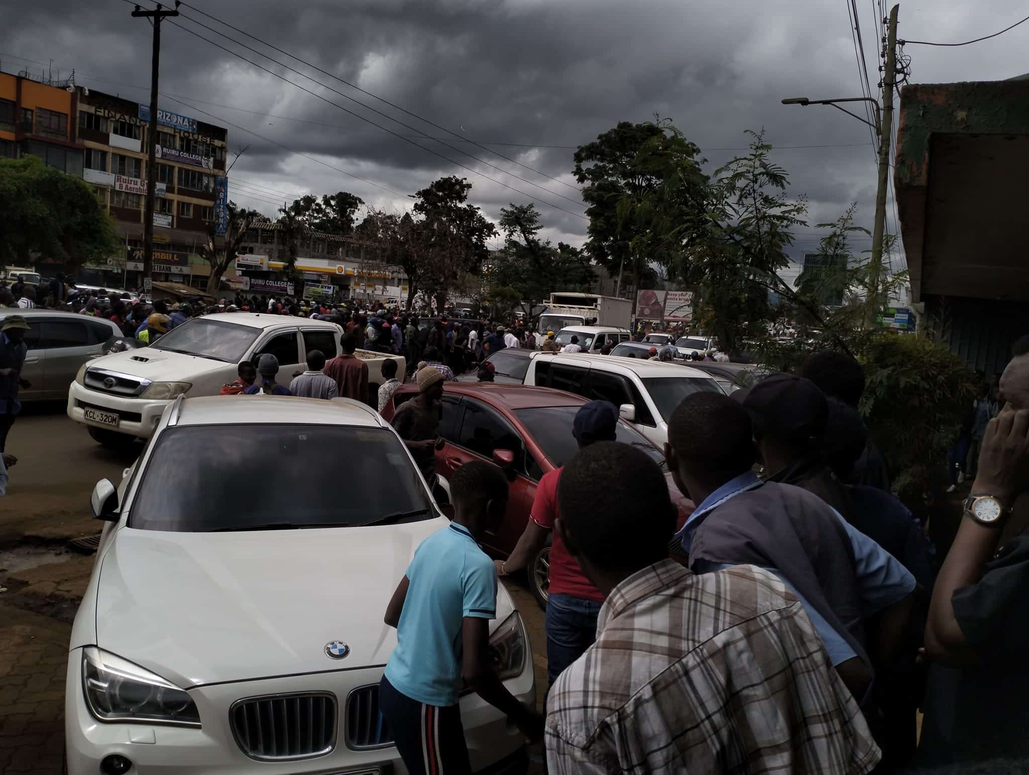 Residents in Ruiru Town gather around the scene where the suspect was arraested.