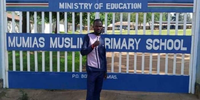 Famous political enthuathiast Nuru Okanga poses for a photo outside the Mumias Muslim Primary School in Kakamega.